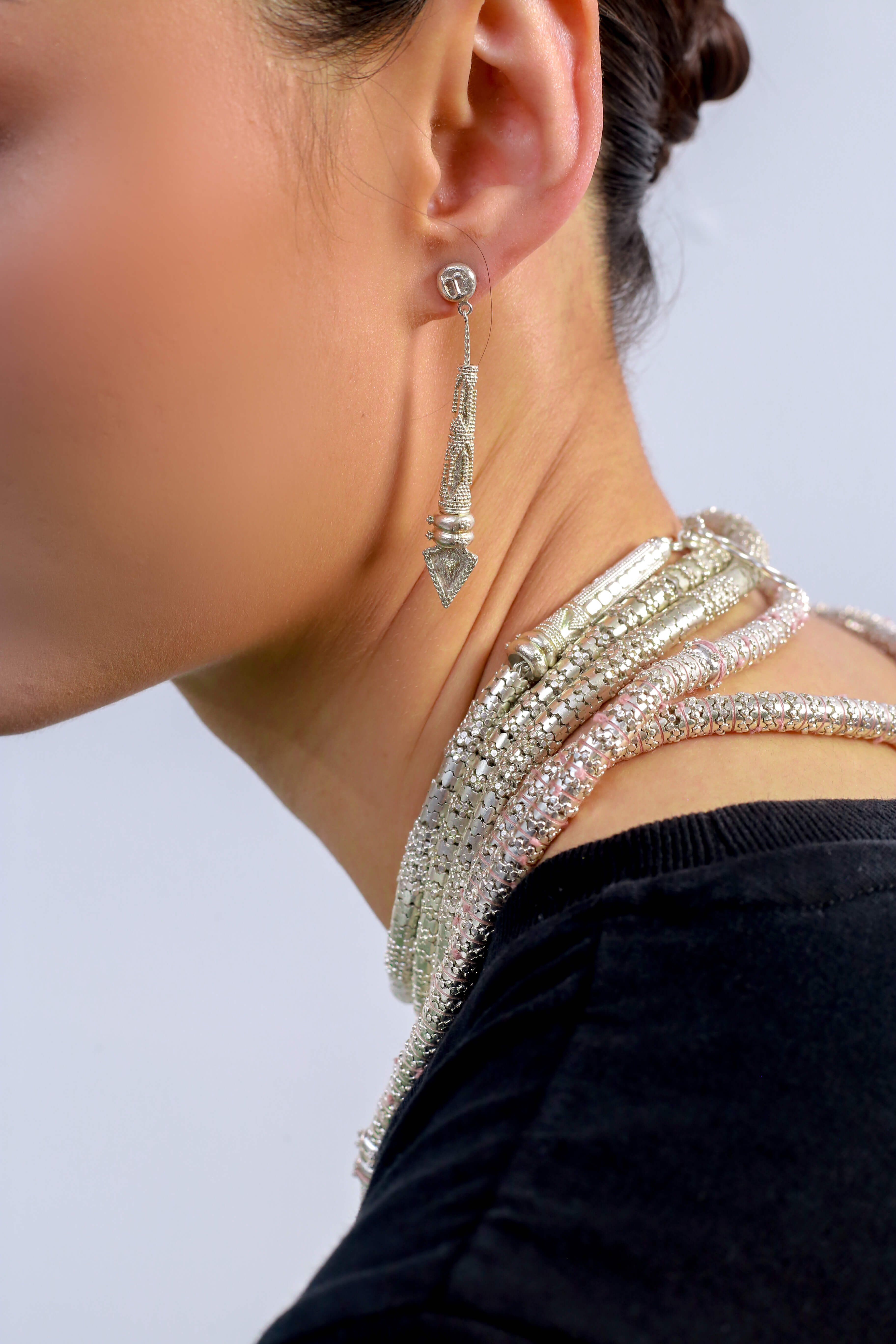 Adam Pereyra's Detailed earrings and necklaces